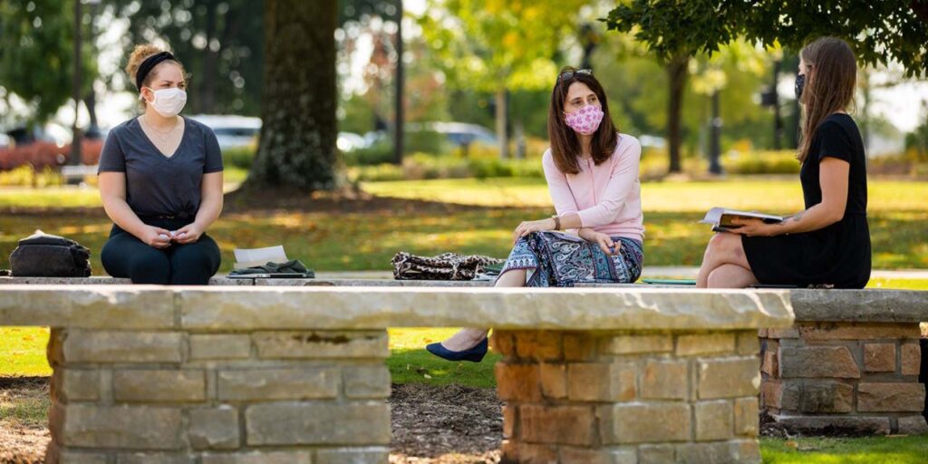 Professor Mary Dzon's graduate English class gathered for a socially-distanced outdoor discussion.